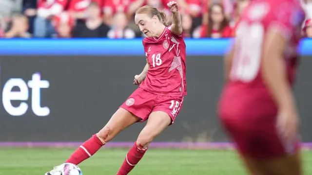 Denmark's midfielder Karen Holmgaard kicks the ball during the UEFA women's Euro 2025 qualifying soccer match league A, group 2 between Denmark and Czech Republic at Vejle Stadium in Vejle, Denmark, on July 16, 2024.