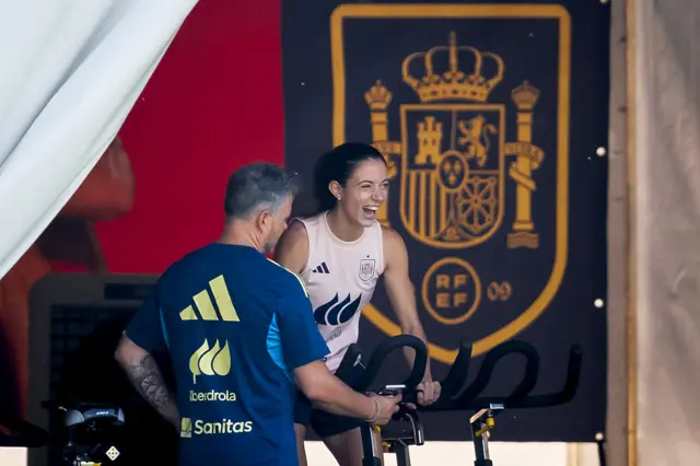 Aitana Bonmati smiling while on an exercise bike