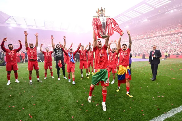 Liverpool's Diogo Jota lifting the Premier League trophy