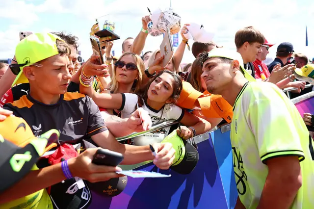 Lando Norris takes picture with fans at Silverstone
