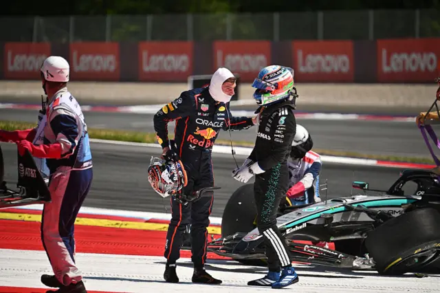 Max Verstappen puts hos arm on Kimi Antonelli's shoulder after the pair collided in Austria