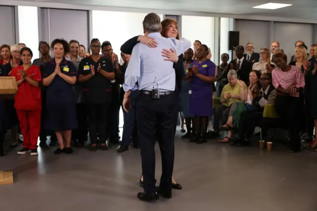 Starmer and Reeves hug