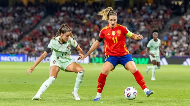 Diana Gomes of Portugal (L) battles for the ball with Alexia Putellas of Spain (R) during the UEFA Womens EURO 2025 Group B match between Spain and Portugal at Stadion Wankdorf on July 3, 2025 in Bern, Switzerland.