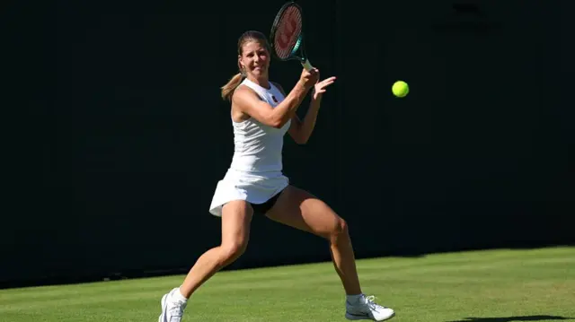 Hannah Klugman plays a forehand