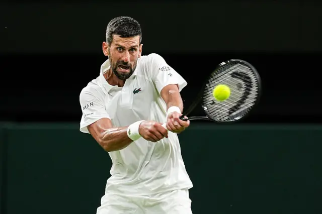 Novak Djokovic hits a tennis ball