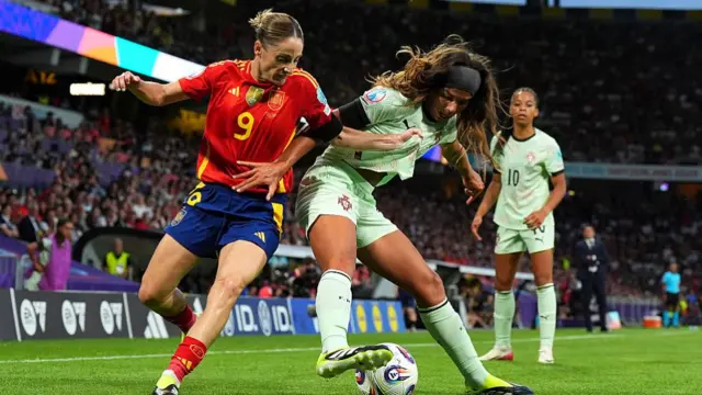 Andreia Jacinto of Portugal is challenged by Esther Gonzalez of Spain during the UEFA Women's EURO 2025 Group B match between Spain and Portugal at Stadion Wankdorf on July 03, 2025 in Bern, Switzerland.