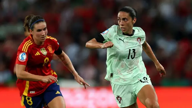 Fatima Pinto of Portugal runs with the ball under pressure from Mariona Caldentey of Spain during the UEFA Women's EURO 2025 Group B match between Spain and Portugal at Stadion Wankdorf on July 03, 2025 in Bern, Switzerland.