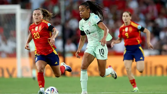Jessica Silva of Portugal runs with the ball under pressure from Claudia Pina of Spain during the UEFA Women's EURO 2025 Group B match between Spain and Portugal at Stadion Wankdorf on July 03, 2025 in Bern, Switzerland.