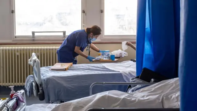 a general view of staff on a NHS hospital ward at Ealing Hospital in London