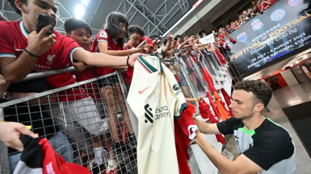 Diogo Jota with Liverpool supporters
