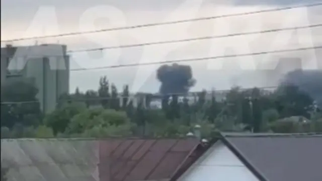 This screengrab from the verified video shows a smoke cloud rising in the distance