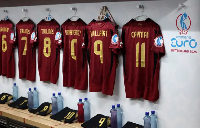 Belgium shirts hang in their dressing room