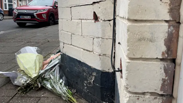 Bouquets of flowers on the pavement