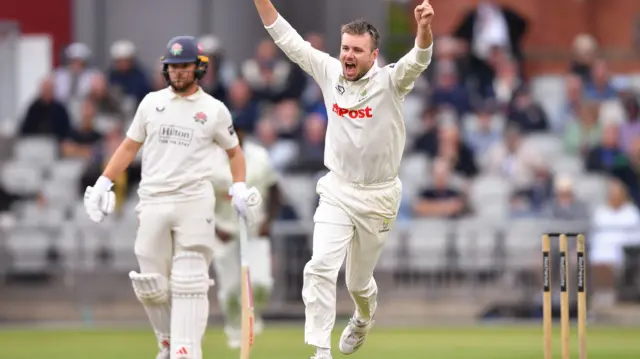 Mason Crane celebrates taking wicket