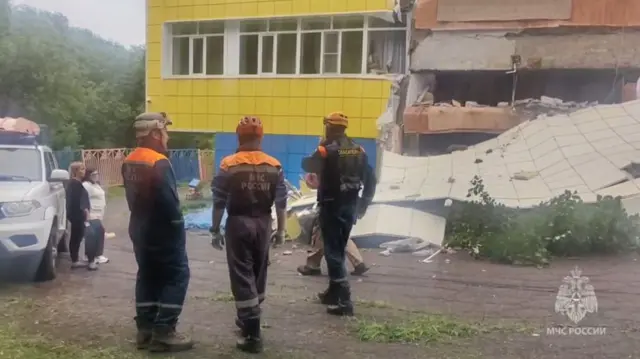 A screen grab from a video shows rescuers of the Ministry of Emergency Situations of Russia inspecting a damaged building after magnitude 8.8 earthquake hits Kamchatka Peninsula .