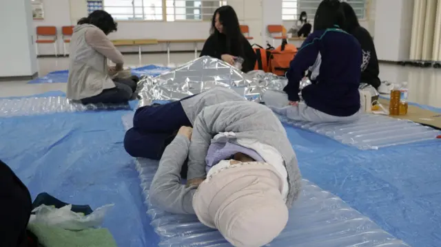 Residents at an evacuation centre in Hokkaido