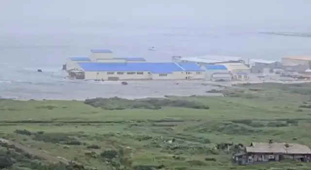 Tsunami waves surge on shore in the Russian town of Severo-Kurilsk.