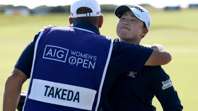 Rio Takeda embraces her caddy