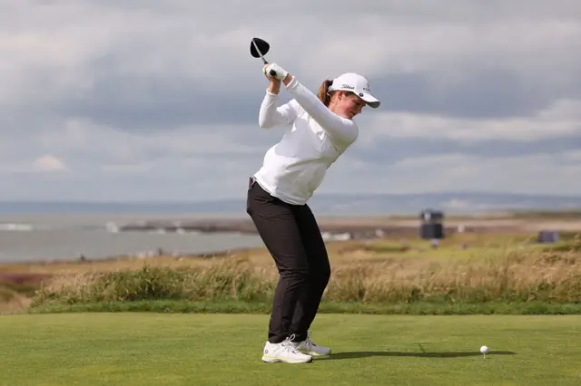 Lottie Woad tees off