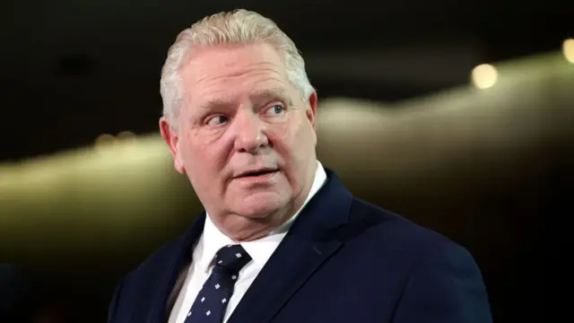 Doug Ford wearing a dark suit and tie
