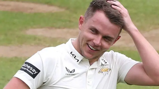 Sam Curran smiling