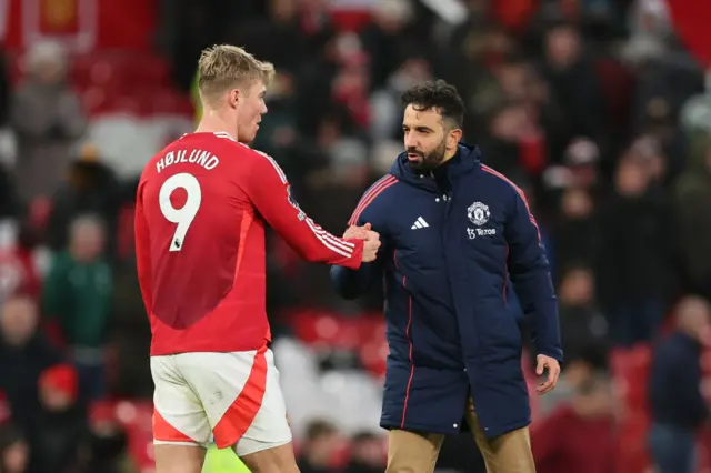 Rasmus Hojlund and Ruben Amorim shake hands