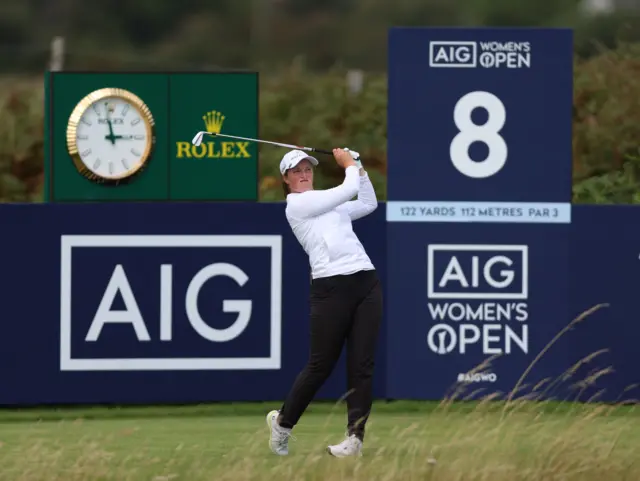 Lottie Woad tees off at the eighth