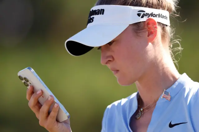 Nelly Korda on the phone
