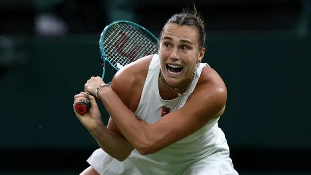 Aryna Sabalenka plays a backhand