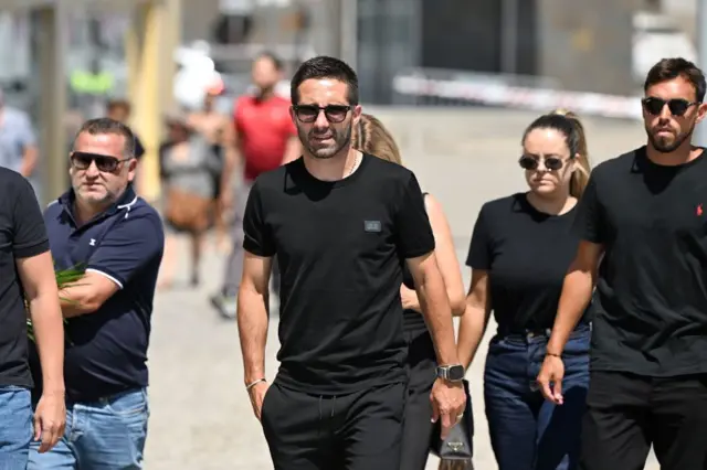 João Moutinho walking with  Ricardo Horta on his right