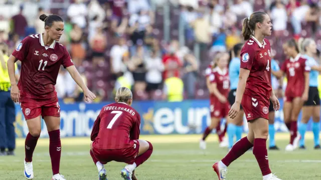 Denmark's Katrine Veje (L), Sanne Troelsgaard (C) and Emma Faerge (R) look disappointed after losing the UEFA Women's EURO 2025 group stage soccer match against Sweden