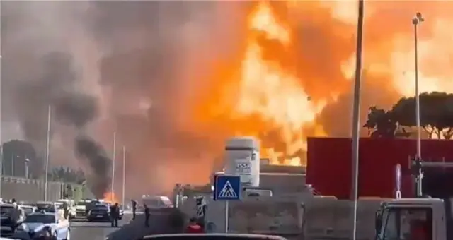 A screengrab from a video posted to social media showing flames shooting into the Rome sky