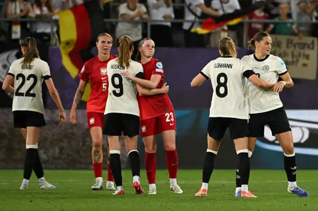 Germany's and Poland's team players react