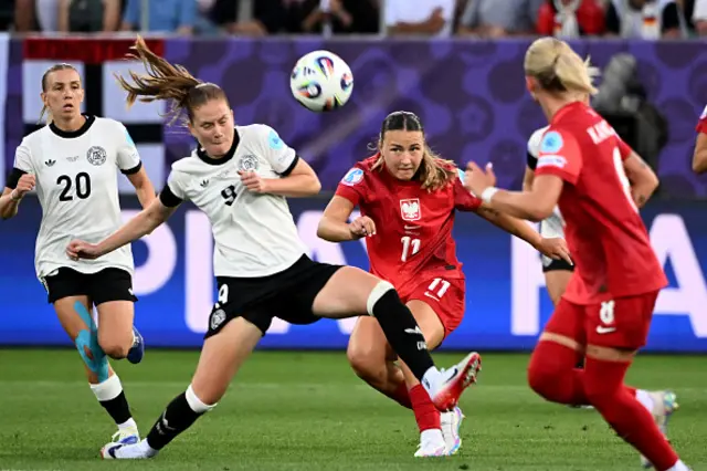 Sjoeke Nuesken and Poland's midfielder Tanja Pawollek fight for the ball