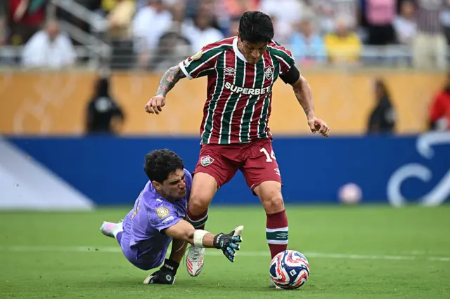 Yassine Bounou makes a save from German Cano