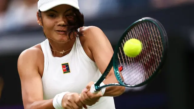 Emma Raducanu plays a backhand return