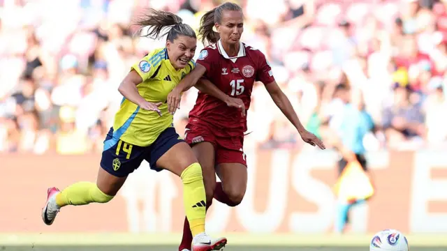 Nathalie Bjoern of Sweden battles for possession with Frederikke Thoegersen of Denmark during the UEFA Women's EURO 2025 Group C match between Denmark and Sweden at Stade de Geneve