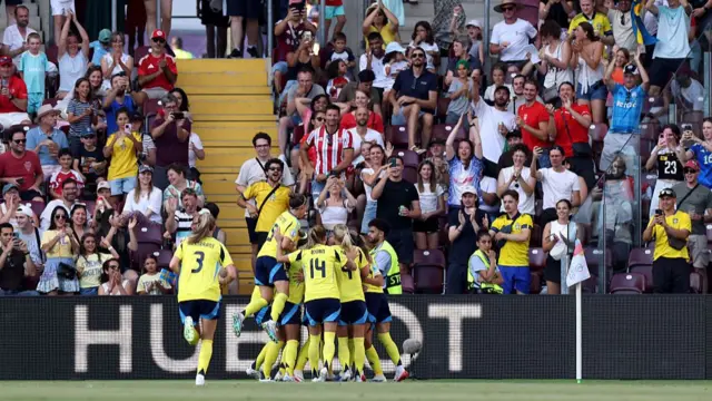 Filippa Angeldal of Sweden celebrates scoring her team's first goal with teammates during the UEFA Women's EURO 2025 Group C match between Denmark and Sweden at Stade de Geneve