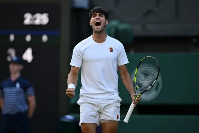 Carlos Alcaraz celebrates winning