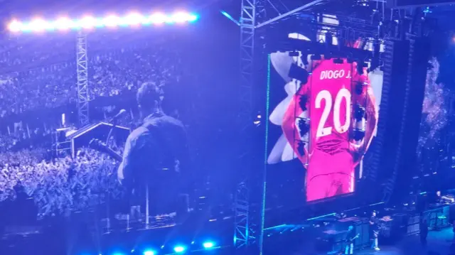 Teh stage at the Principality for the Oasis tour with a photo of the back of the shirt of Diogo Jota