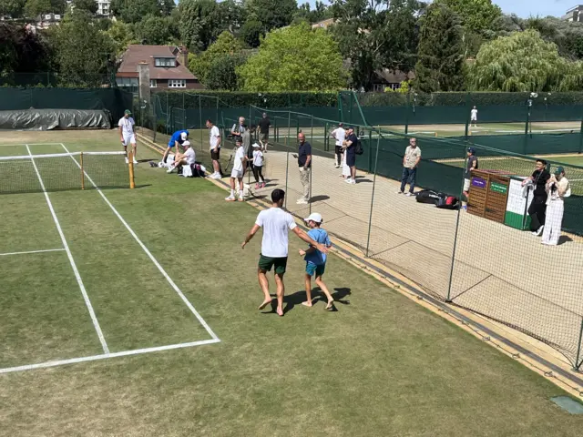 Novak Djokovic warms down with son Stefan