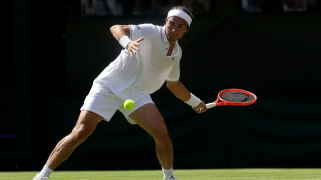 Mattia Bellucci plays a forehand