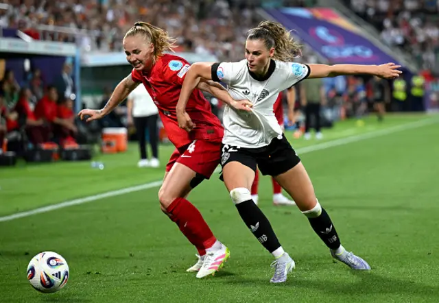 Paulina Dudek of Poland battles for possession with Jule Brand