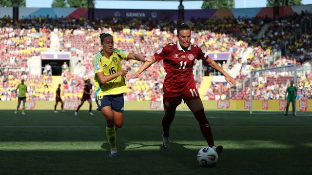 Katrine Veje of Denmark is challenged by Filippa Angeldal of Sweden during the UEFA Women's EURO 2025 Group C match between Denmark and Sweden at Stade de Geneve