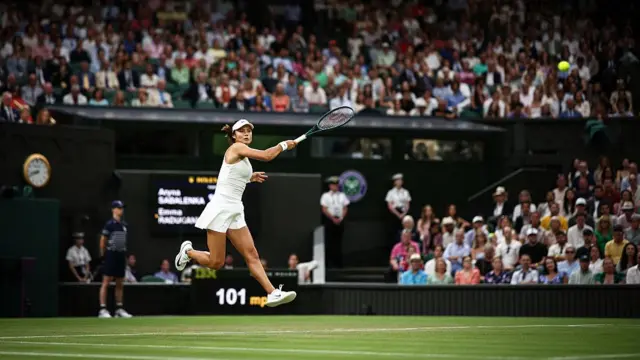 Emma Raducanu plays a forehand return