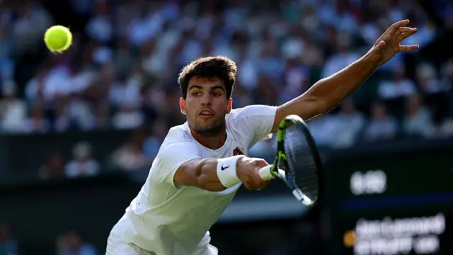 Carlos Alcaraz of Spain plays a backhand