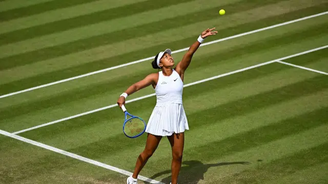 Naomi Osaka serves