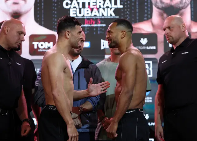 Jack Catterall holds out his hand to Harlem Eubank during a face-off