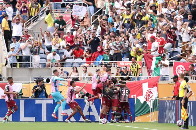 Fluminense players celebrate Hercules' winner
