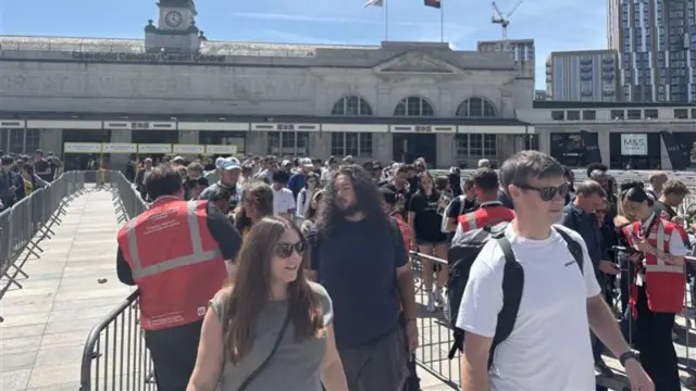 Crowds of people outside Cardiff station